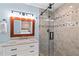Bathroom features stylish tile, glass shower, and a marble countertop vanity at 2599 Church Nw St, Atlanta, GA 30318