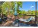 Spacious deck features an umbrella, a lounge chair, and green trees and blue skies at 2599 Church Nw St, Atlanta, GA 30318