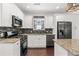 Bright kitchen featuring stainless steel appliances and granite countertops at 2599 Church Nw St, Atlanta, GA 30318