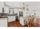 Well-lit eat-in kitchen with granite counters, stainless appliances, and backyard access at 2599 Church Nw St, Atlanta, GA 30318