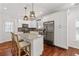 Modern kitchen with stainless steel appliances, granite countertops, and island with barstools at 2599 Church Nw St, Atlanta, GA 30318