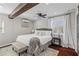 Modern main bedroom with hardwood floors, ceiling fan and a large window at 2599 Church Nw St, Atlanta, GA 30318