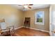 Bedroom with hardwood floors, rocking chair, and natural light at 42 Winchester Dr, Euharlee, GA 30145