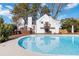 Backyard view features a blue swimming pool, home's exterior, and manicured landscaping at 2762 Whitehurst Ne Dr, Marietta, GA 30062