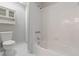 Bathroom featuring a white toilet, shower, tub with tiled walls, and built-in cabinet at 2762 Whitehurst Ne Dr, Marietta, GA 30062