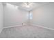 Bedroom featuring soft carpet, a ceiling fan, and window, offering comfort and style at 2762 Whitehurst Ne Dr, Marietta, GA 30062