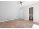 A bright bedroom includes a view into an ensuite half bathroom with white paint and tile flooring at 2762 Whitehurst Ne Dr, Marietta, GA 30062