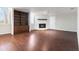 Living room with wood floors, fireplace, and built-in shelving providing a warm and inviting space at 2762 Whitehurst Ne Dr, Marietta, GA 30062