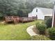 Backyard with lush landscaping, an above-ground pool and a deck area, great for entertaining at 3220 Indian Shoals Rd, Dacula, GA 30019