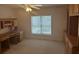 Bright bedroom with a large window, built-in shelving and carpeted flooring at 3220 Indian Shoals Rd, Dacula, GA 30019