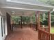 A rustic wooden deck with decorative wind chimes overlooks a lush green yard, perfect for outdoor relaxation at 3220 Indian Shoals Rd, Dacula, GA 30019