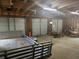 Interior of a three car garage, perfect for storing equipment, tools, trailers, and vehicles at 3220 Indian Shoals Rd, Dacula, GA 30019