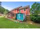 Backyard featuring an outbuilding, well-kept lawn and exterior views of the home at 3460 Trow Creek Ln, Cumming, GA 30040