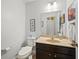 Comfortable half bath featuring a sink, mirror, and modern fixtures at 3460 Trow Creek Ln, Cumming, GA 30040