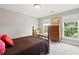 Cozy bedroom with natural light, neutral color palette, and carpeted floors at 3460 Trow Creek Ln, Cumming, GA 30040