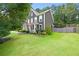 Charming two-story home with manicured lawn, attractive landscaping, and inviting front porch at 3460 Trow Creek Ln, Cumming, GA 30040