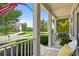 Inviting front porch with white railings and a cozy seating area overlooking the neighborhood at 3460 Trow Creek Ln, Cumming, GA 30040
