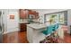 Eat-in kitchen with granite island, stainless steel appliances, and backyard access at 3460 Trow Creek Ln, Cumming, GA 30040