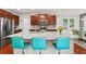 Eat-in kitchen features a granite island, stainless steel appliances and seating for three at 3460 Trow Creek Ln, Cumming, GA 30040