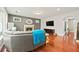 Bright living room with a fireplace, hardwood floors, and comfortable seating arrangement at 3460 Trow Creek Ln, Cumming, GA 30040