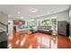 Open-concept living area with hardwood floors, kitchen island, and modern decor at 3460 Trow Creek Ln, Cumming, GA 30040
