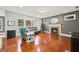 Spacious living room with hardwood floors, fireplace, and ample natural light at 3460 Trow Creek Ln, Cumming, GA 30040