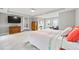 Bright and airy main bedroom with a bed, sitting area, and ensuite bathroom at 3460 Trow Creek Ln, Cumming, GA 30040