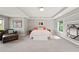 Large primary bedroom featuring a seating area and natural light at 3460 Trow Creek Ln, Cumming, GA 30040