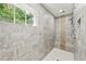 Luxurious tile shower with multiple shower heads and a built-in bench at 3460 Trow Creek Ln, Cumming, GA 30040