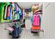 A walk-in closet is pictured with ample hanging space and shelving for storage at 3460 Trow Creek Ln, Cumming, GA 30040