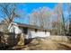 View of backyard and the exterior of the home at 114 Howell Sw Dr, Atlanta, GA 30331
