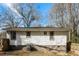 Backyard view showcases the exterior of the home with white siding at 114 Howell Sw Dr, Atlanta, GA 30331