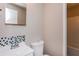 Bathroom featuring tiled accents, a toilet, sink and walk in shower at 114 Howell Sw Dr, Atlanta, GA 30331
