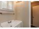 This bathroom offers a sleek vanity, modern fixtures and a neutral color palette at 114 Howell Sw Dr, Atlanta, GA 30331