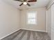 This bedroom includes a ceiling fan, closet, neutral walls and carpet at 114 Howell Sw Dr, Atlanta, GA 30331