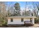 Charming single-story home featuring a cozy front porch and neutral siding at 114 Howell Sw Dr, Atlanta, GA 30331