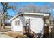 Exterior view of home showcasing the siding, roof and backyard at 114 Howell Sw Dr, Atlanta, GA 30331