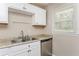 Close-up of the kitchen with stainless appliances, and dual stainless sink at 114 Howell Sw Dr, Atlanta, GA 30331