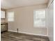 Bright kitchenette with sleek gray flooring, neutral walls, and view from the windows at 114 Howell Sw Dr, Atlanta, GA 30331