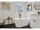 Serene bathroom boasts a soaking tub, modern fixtures, and ample natural light at 2302 Fairoaks Rd, Decatur, GA 30033