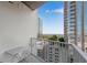 Condo balcony with table and chairs with a view of the city at 860 Peachtree Ne St # 1502, Atlanta, GA 30308