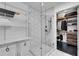Bathroom featuring a glass walk-in shower and an organized walk-in closet at 860 Peachtree Ne St # 1502, Atlanta, GA 30308
