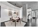 Dining area features modern lighting, seating for six, and concrete ceilings at 860 Peachtree Ne St # 1502, Atlanta, GA 30308