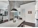 Dining room with modern light fixture, concrete pillar and ceiling at 860 Peachtree Ne St # 1502, Atlanta, GA 30308