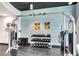 A fitness center offers weight training and wave-patterned wall art at 860 Peachtree Ne St # 1502, Atlanta, GA 30308