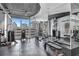 Fitness center boasts mirrored walls and a city skyline view at 860 Peachtree Ne St # 1502, Atlanta, GA 30308