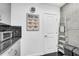 Kitchen area next to a white door and concrete style wall at 860 Peachtree Ne St # 1502, Atlanta, GA 30308
