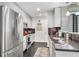 Contemporary kitchen with stainless steel appliances, granite countertops, and modern backsplash at 860 Peachtree Ne St # 1502, Atlanta, GA 30308