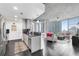 Bright living space featuring hardwood floors, modern kitchen, and floor-to-ceiling windows with city views at 860 Peachtree Ne St # 1502, Atlanta, GA 30308