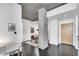 Hallway view of concrete ceiling, dark floors, and dining area at 860 Peachtree Ne St # 1502, Atlanta, GA 30308